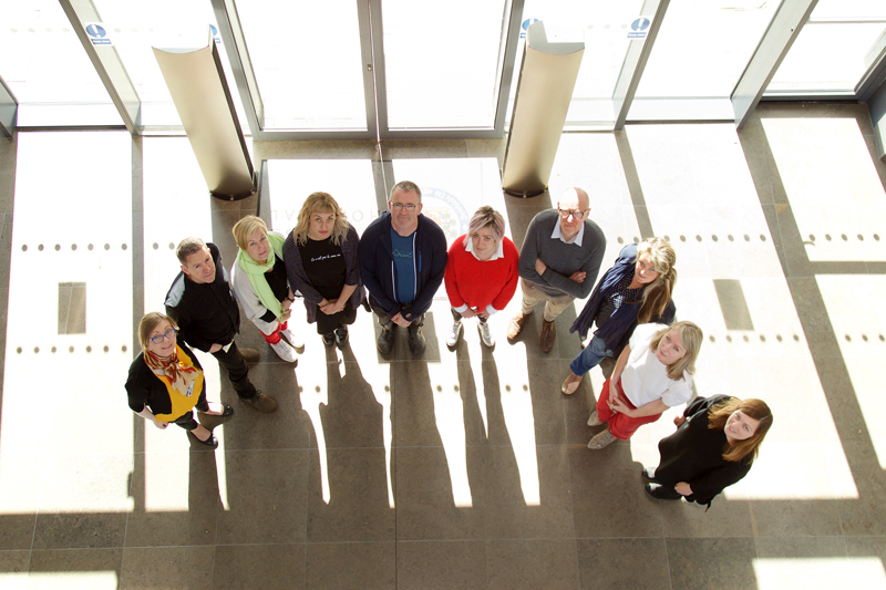 Artists and Age & Opportunity and MISA representative photographed in the lobby of MISA, St